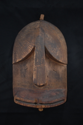 Carved mask (Giinasinaq--Big Face)