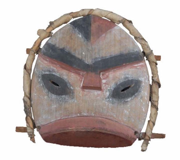 A small wooden mask with a hoop around it.